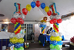 child's first birthday balloon arch