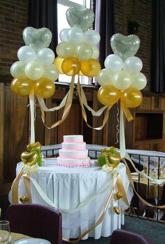 cake table with balloon clouds