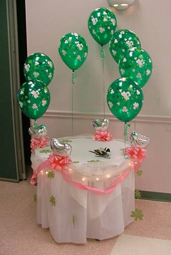 cake table with balloon clouds